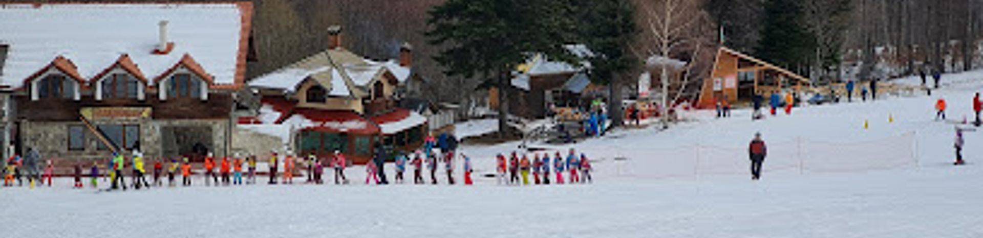 Kulinoto in Bulgaria - a group of people skiing down a hill.