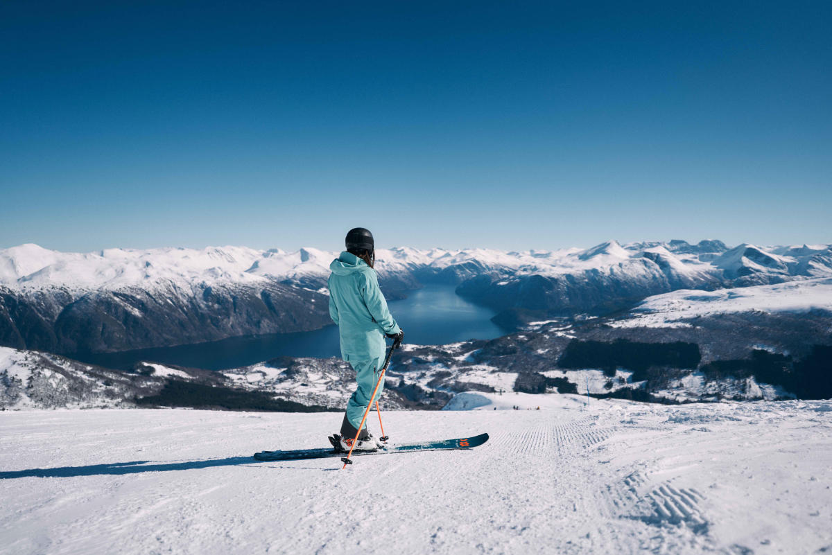 Strandafjellet Skisenter in Norway - a person standing on top of a snow covered mountain.
