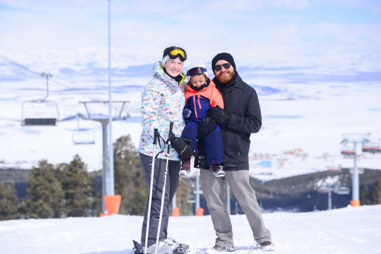 Sarıkamış in Turkey - a man and a young boy standing on a ski slope.