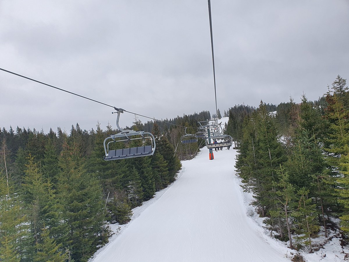 Romme Alpin in Sweden - a ski lift going up a snowy slope.