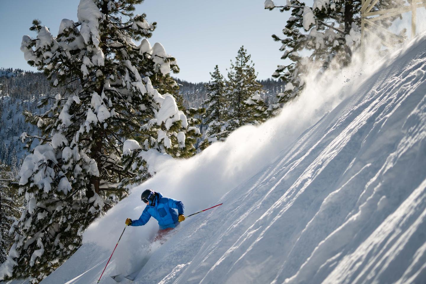 China Peak Mountain Resort in USA - a person skiing down a steep slope in the snow.
