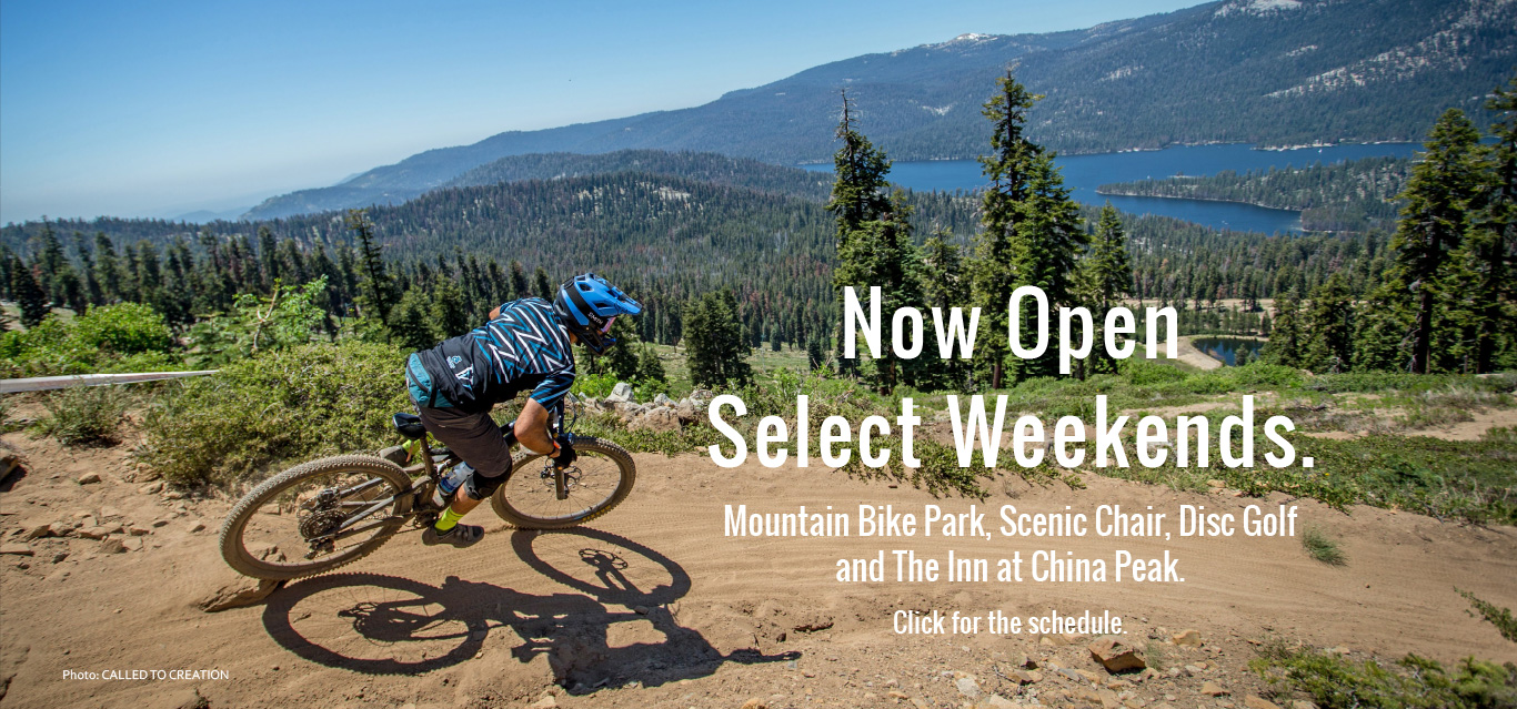 China Peak Mountain Resort in USA - a person riding a mountain bike on a trail.