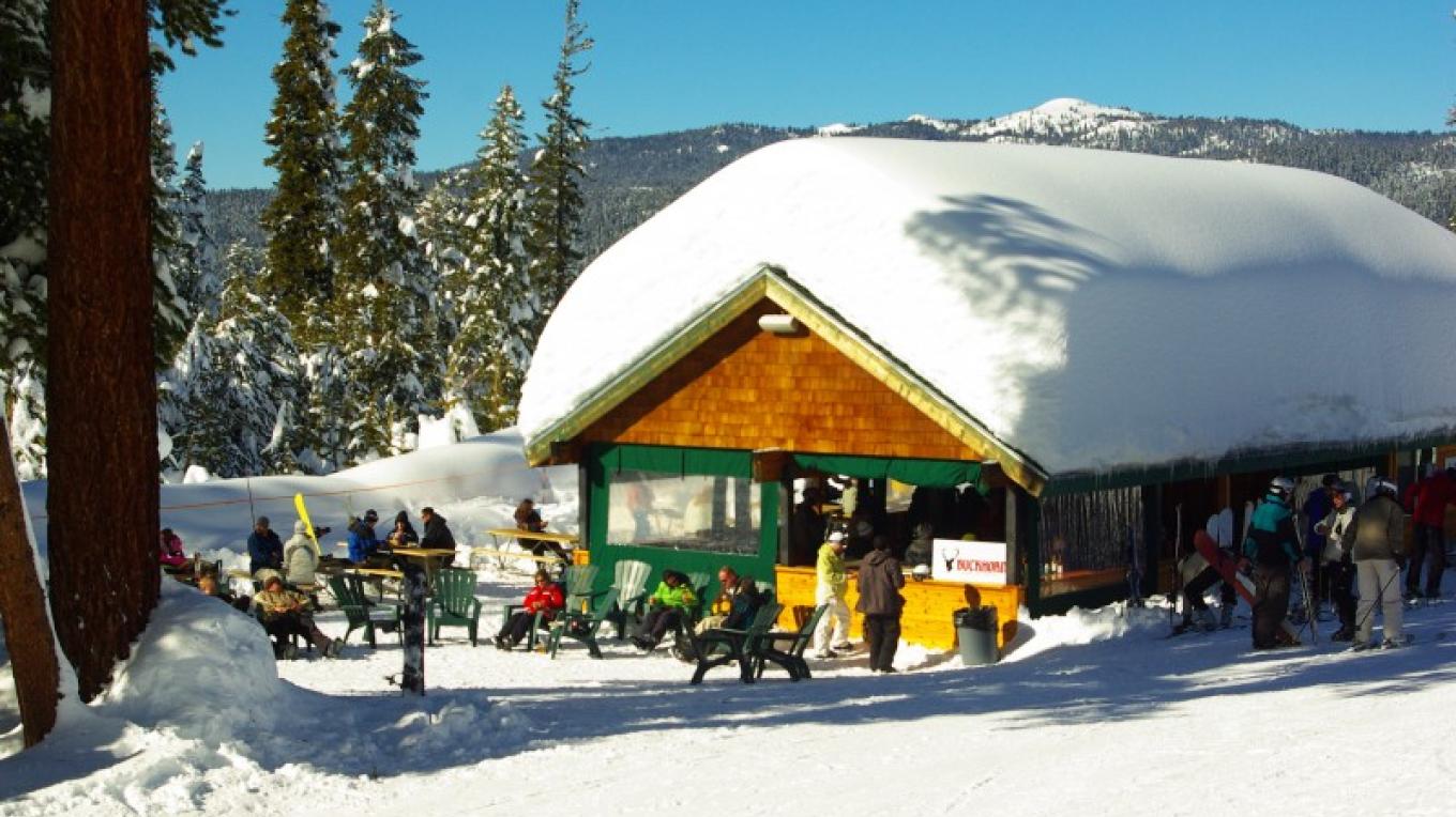 China Peak Mountain Resort in USA - a group of people standing outside in the snow.