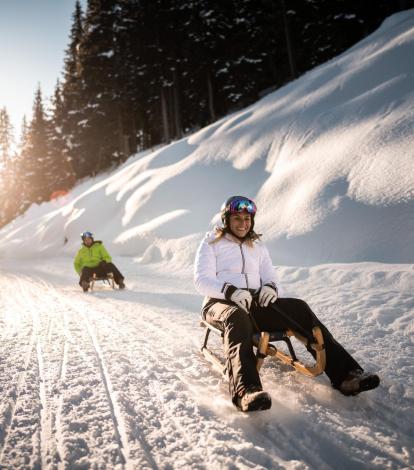 Rosskopf Monte Cavallo in Italy - two people on snowboards going down a hill.