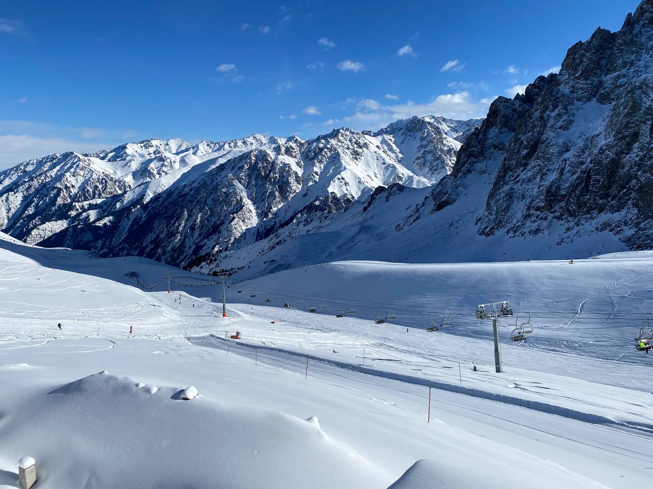 Shymbulak in Kazakhstan - a view of the mountains from a ski slope.