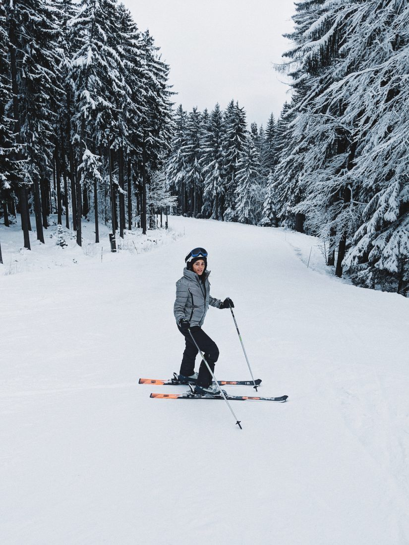 Mariborsko Pohorje in Slovenia - a man riding skis down a snow covered slope.