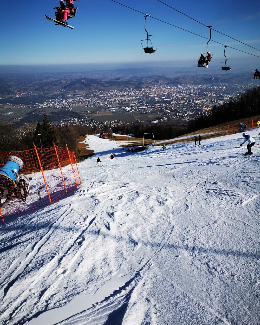 Mariborsko Pohorje in Slovenia - a person riding a ski board on a snowy slope.
