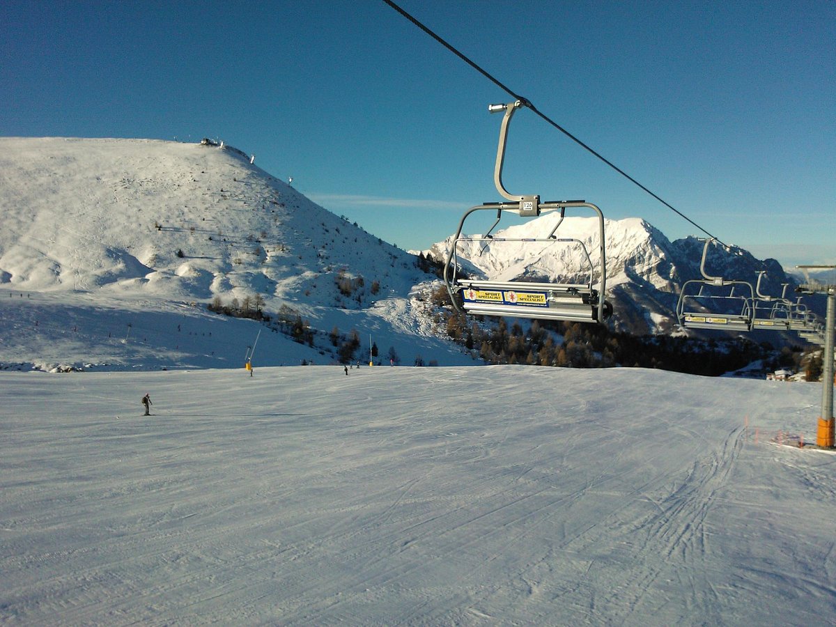 Piani di Bobbio in Italy - a ski lift going up a snowy slope.