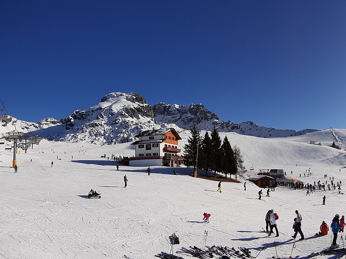 Piani di Bobbio in Italy - a group of people skiing down a snowy slope.