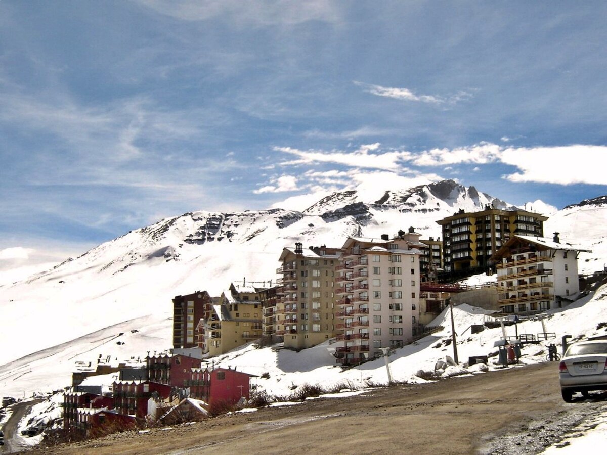 El Colorado | Farellones in Chile - a car parked on the side of a snowy road.