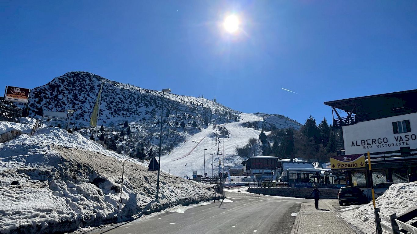 Monte Bondone in Italy - the sun is shining over the snow covered mountains.