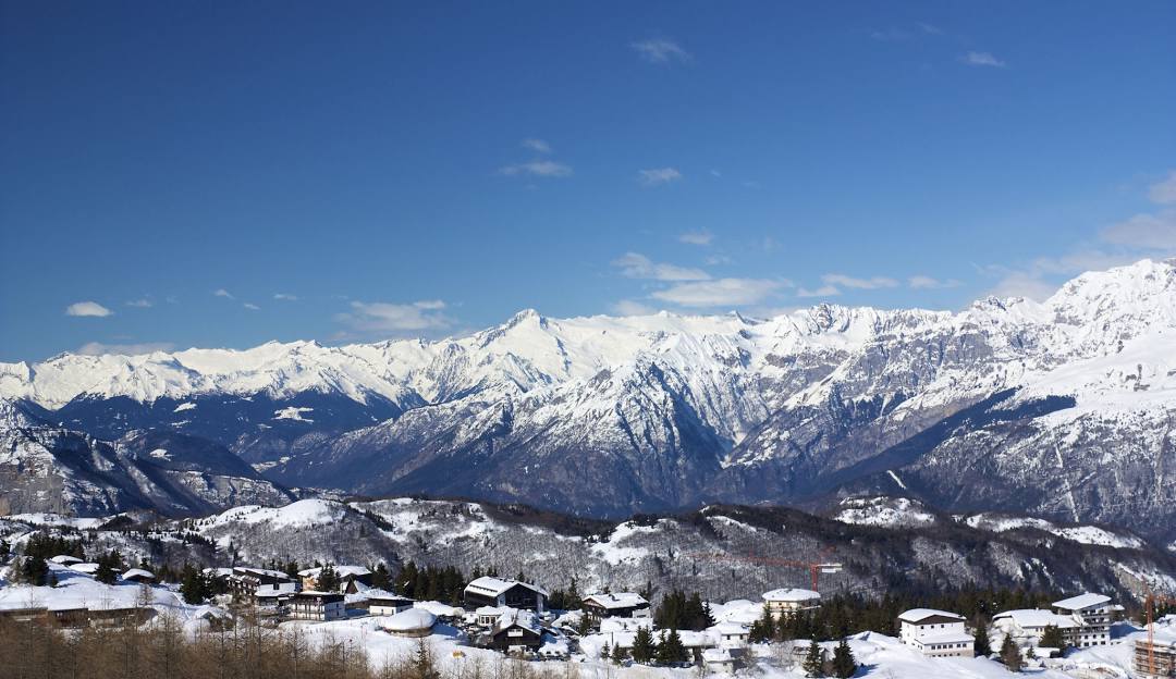 Monte Bondone in Italy - snow covered mountains in the background.