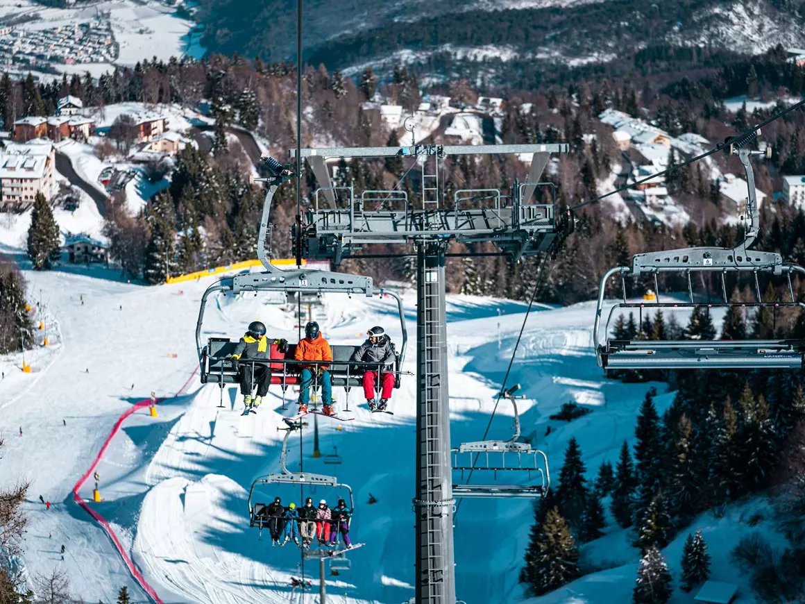 Monte Bondone in Italy - a ski lift going up the mountain.