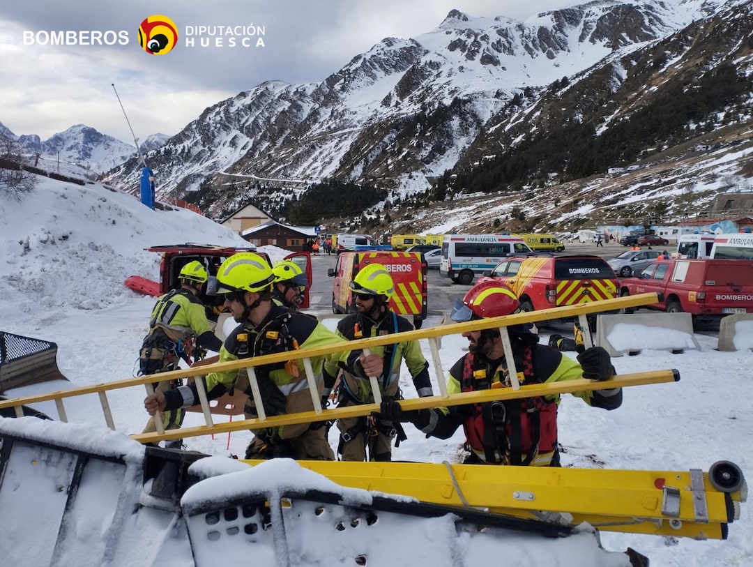 Astún in Spain - a group of rescue workers working on the side of a road.