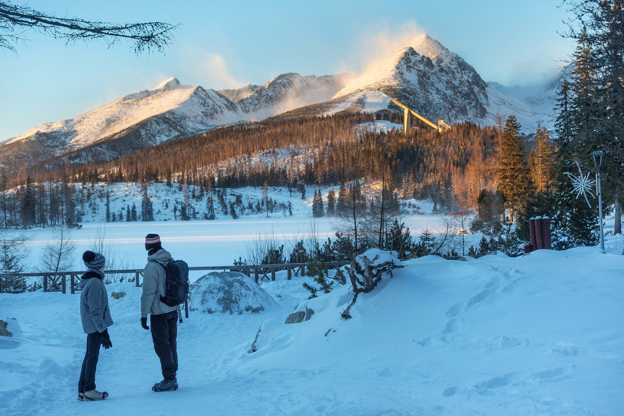 Štrbské Pleso in Slovakia - a man and a woman standing in the snow.