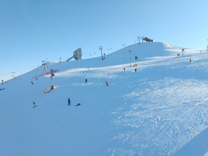 Canada Olympic Park – Calgary in Canada - a group of people skiing down a snowy hill.