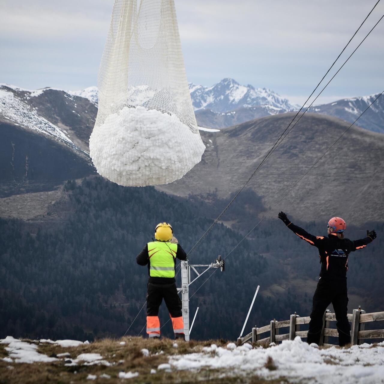 Luchon Superbagnères in France - two people standing on top of a mountain.