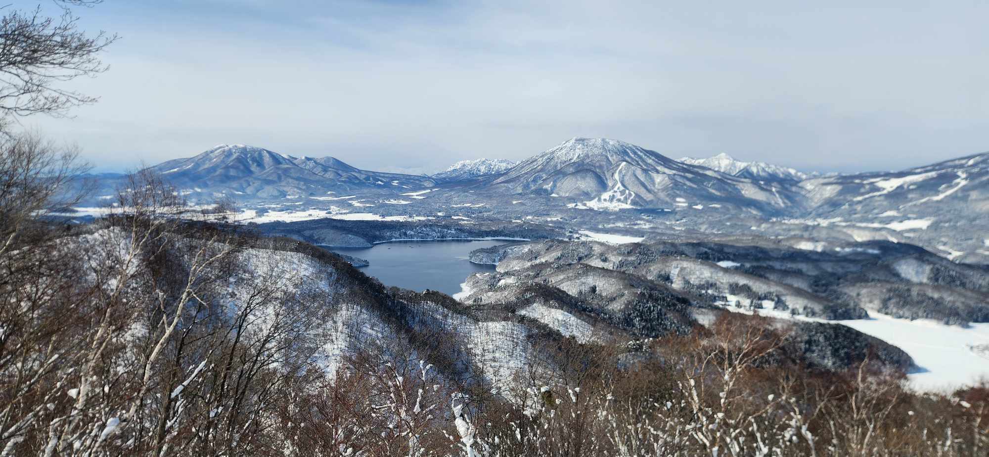 Hinata in Japan - a view of a lake and mountains in the distance.