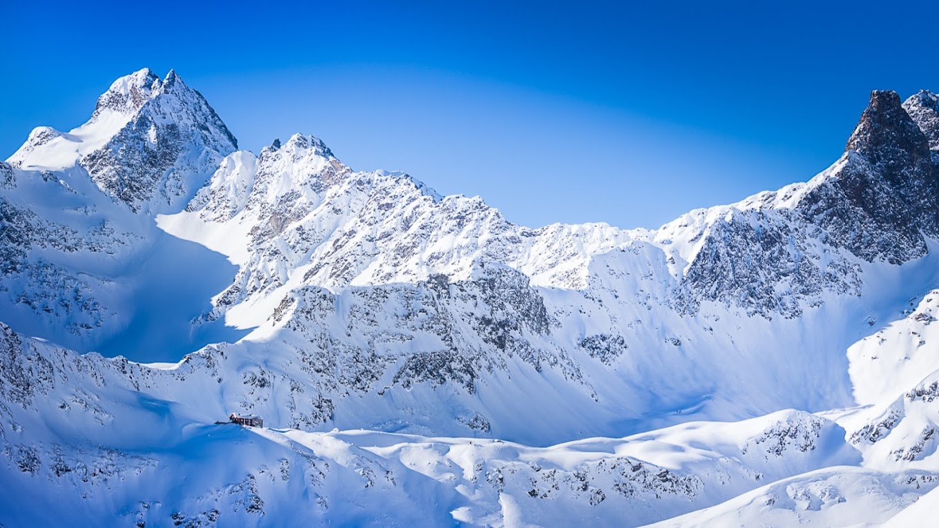 Kappl in Austria - a mountain range with snow covered mountains in the background.