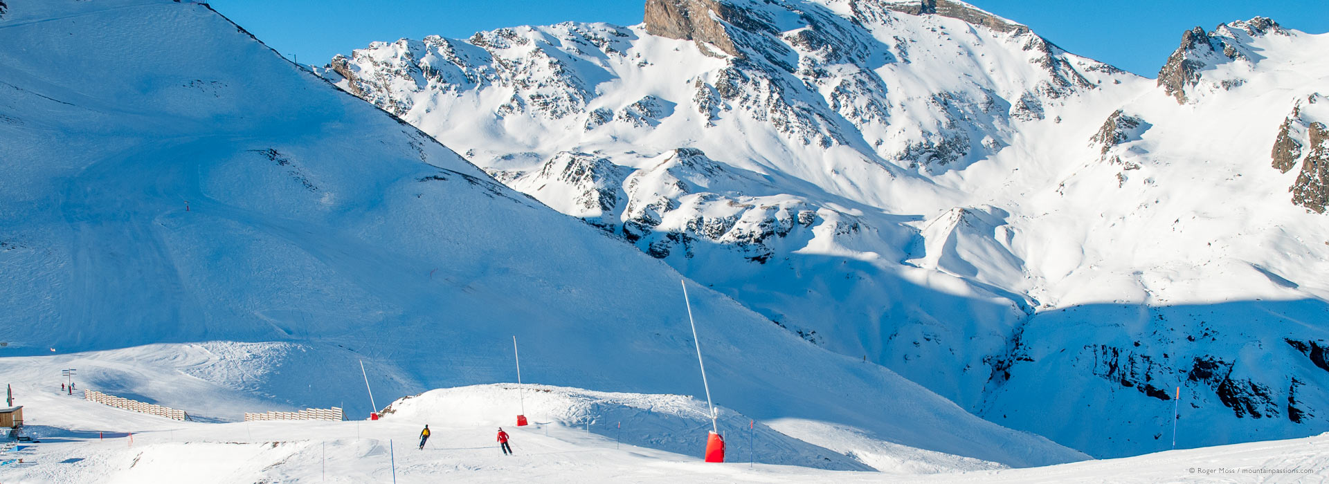 Piau-Engaly in France - a group of people skiing down a snow covered mountain.