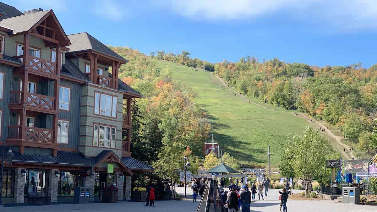 Blue Mountain Resort in Canada: a group of people walking in front of a building.