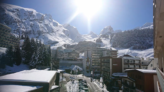 View of Station Gourette ski resort in France, featuring a charming chalet and bustling winter sports scene amidst beautiful winter scenery.
