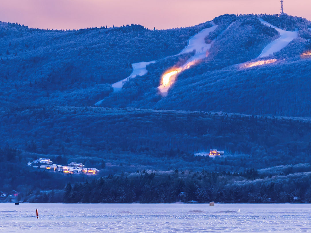 Mt Sunapee in USA - the mountains are covered in snow.