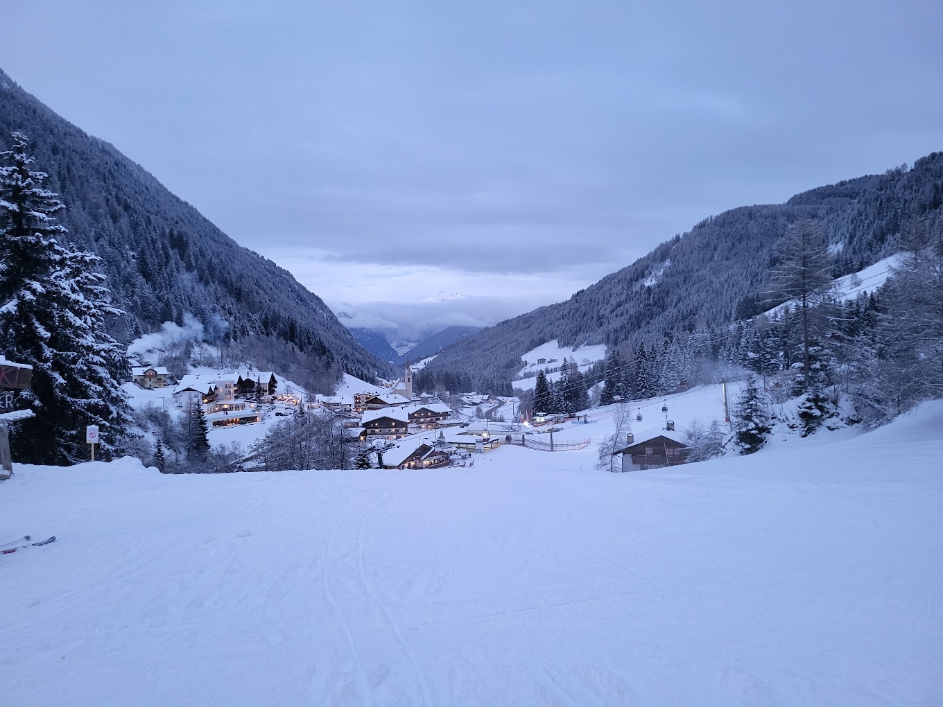 Racines-Giovo in Italy - a view of a snowy village in the mountains.