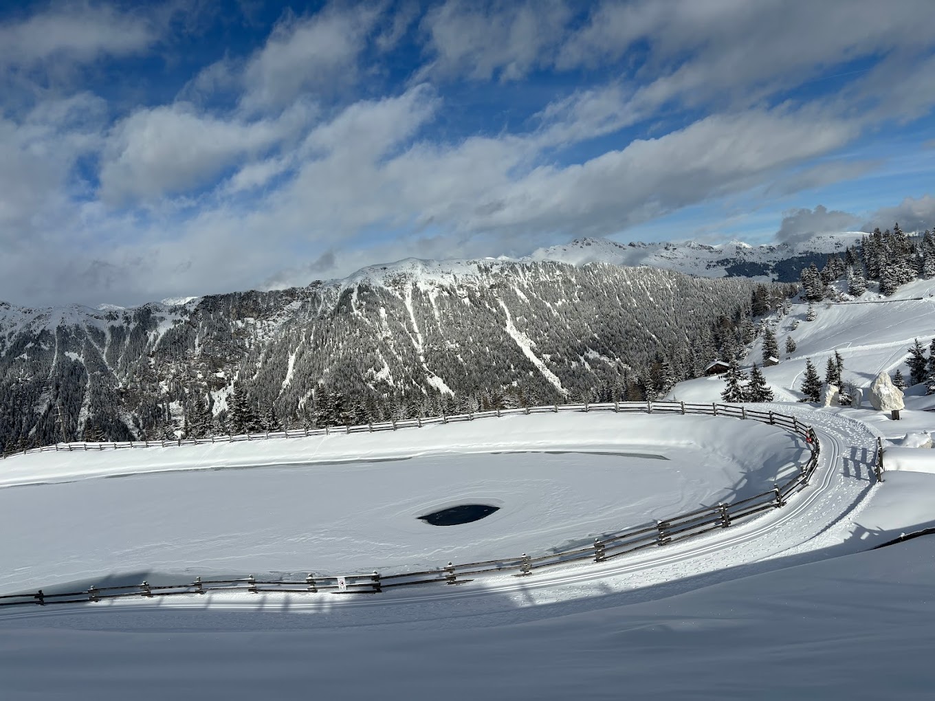 Racines-Giovo in Italy - a snowy landscape with mountains in the background.