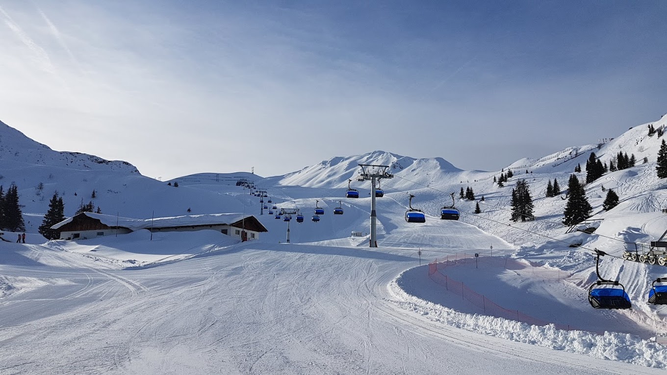 Racines-Giovo in Italy - a ski slope with a ski lift going down it.