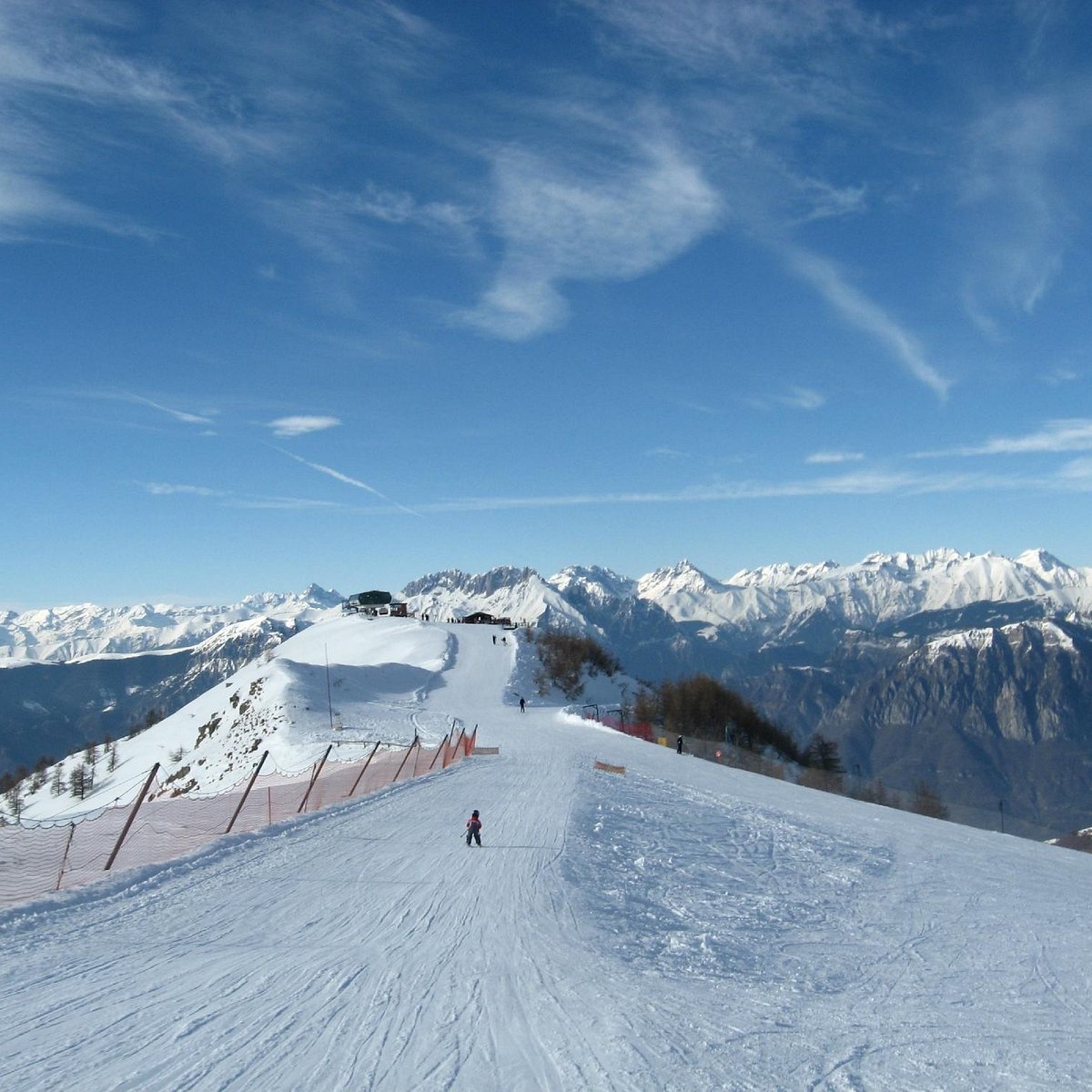 Montecampione Ski Area in Italy - a person on a snowboard on a mountain.