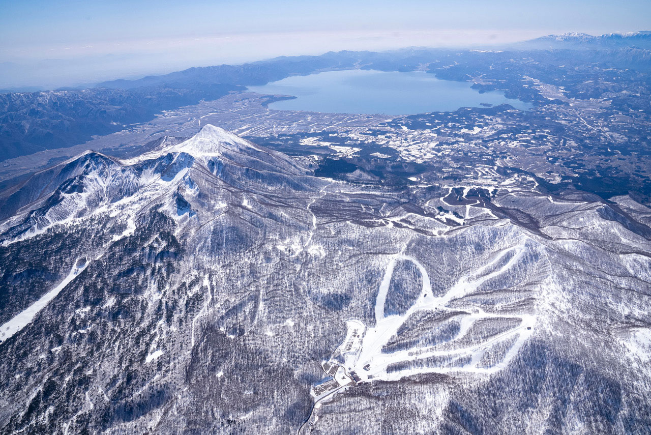 Alts Bandai - Hoshino Resorts Nekoma Mountain in Japan - a view of the mountains from an airplane.