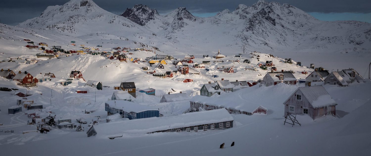 Qasigiannguit in Greenland - a small town in the middle of a snowy mountain.