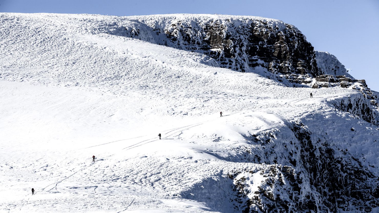 Alpe du Grand Serre in France - a group of people walking up the side of a mountain.