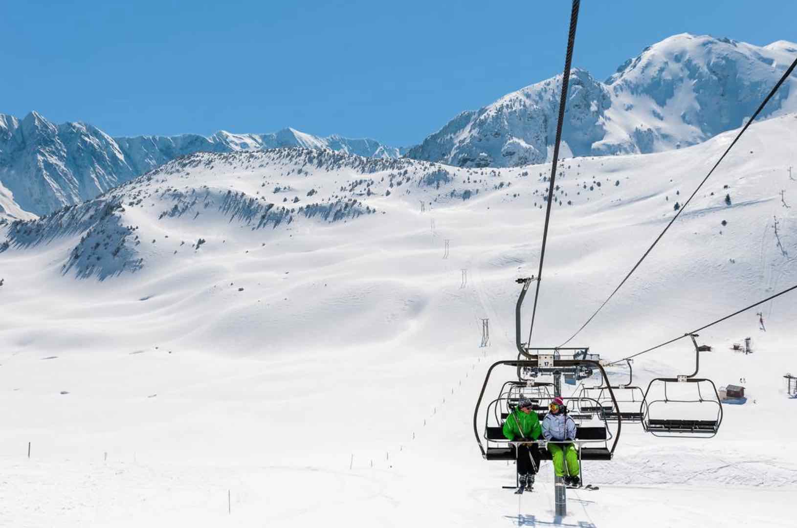 Alpe du Grand Serre in France - a person riding a ski lift in the snow.