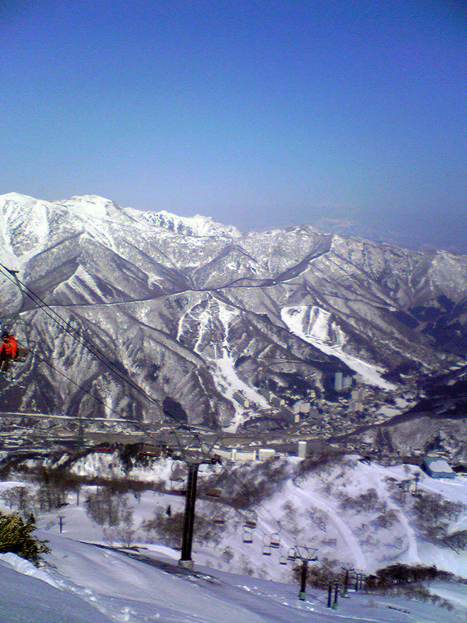 Naeba in Japan - a person on a ski board in the snow.