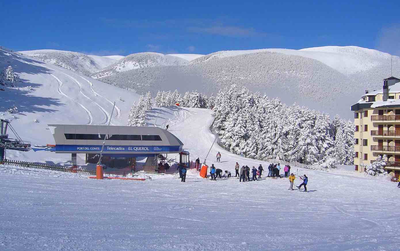 Port del Comte in Spain - a group of people skiing down a snowy slope.