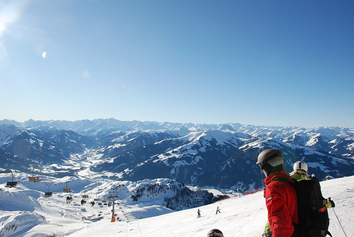 Kitzbüheler Horn in Austria - a person standing on top of a snow covered mountain.