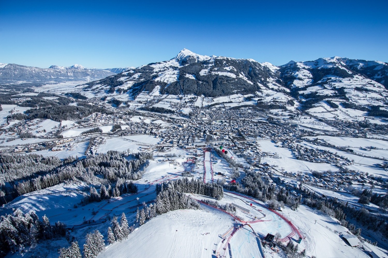 Kitzbüheler Horn in Austria: a view of a ski resort from the top of a mountain.