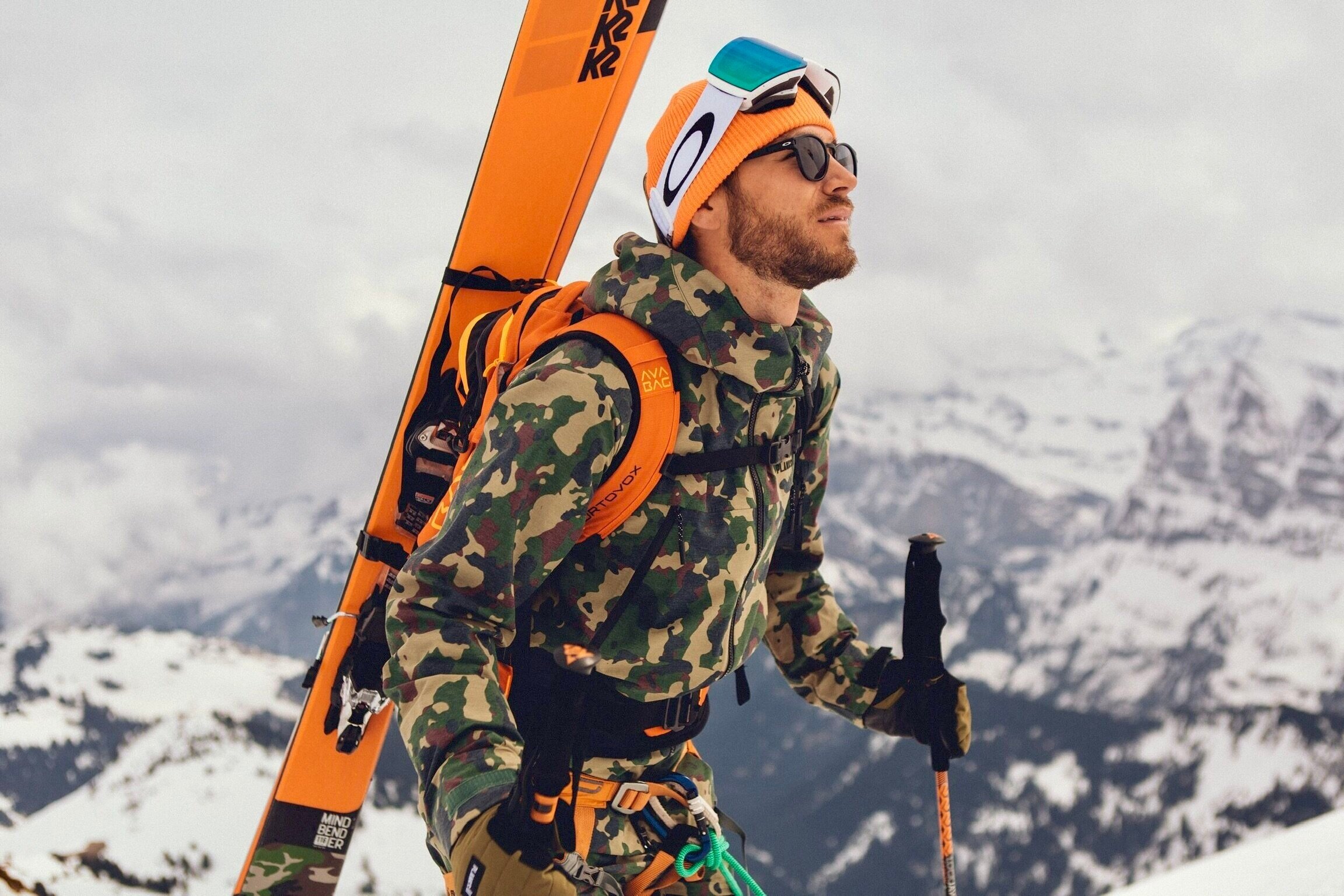 Ski Avoriaz in France - a man in camouflage holding a pair of skis.