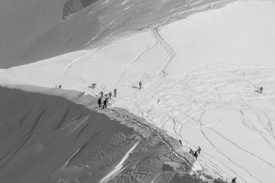 Chamonix Mont-Blanc in France - a group of people walking up the side of a mountain.