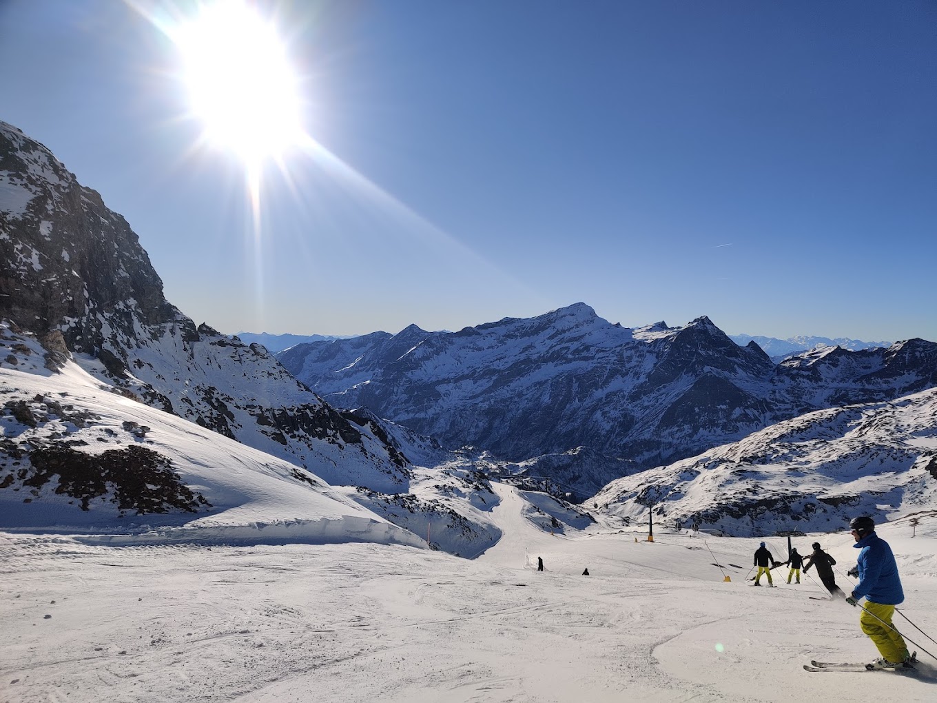 Monterosa in Italy - a group of people skiing down a snow covered mountain.