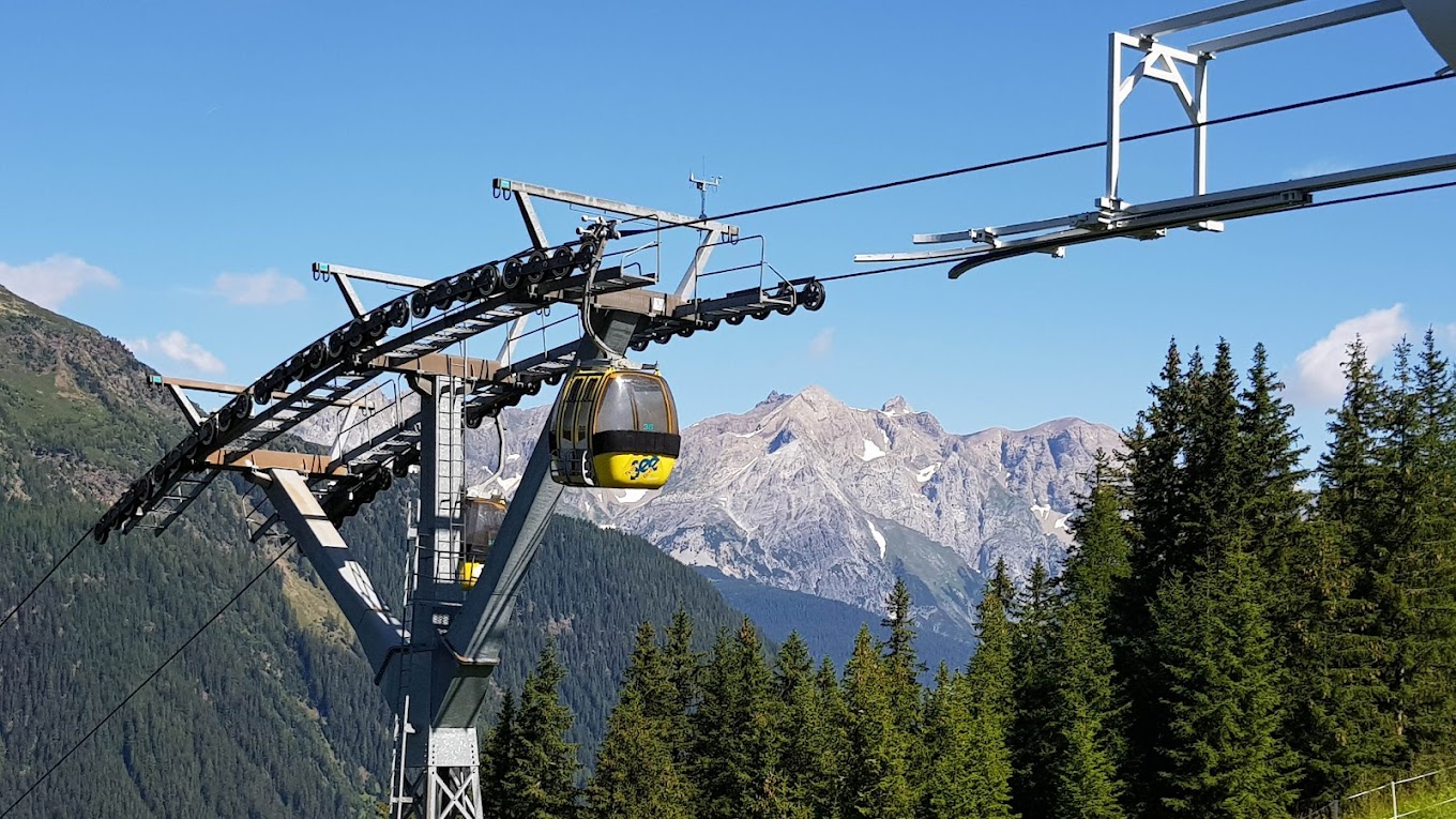 See in Austria - a ski lift going up a mountain side.