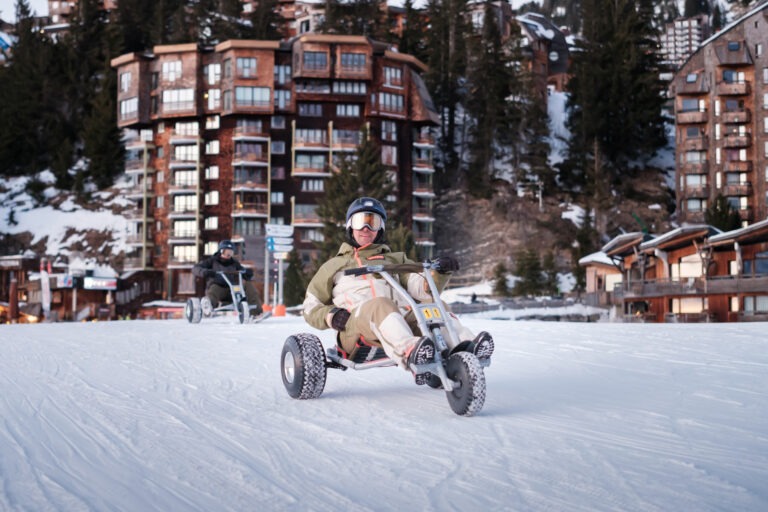 Avoriaz 1800 in France - a person on a snowmobile in the snow.