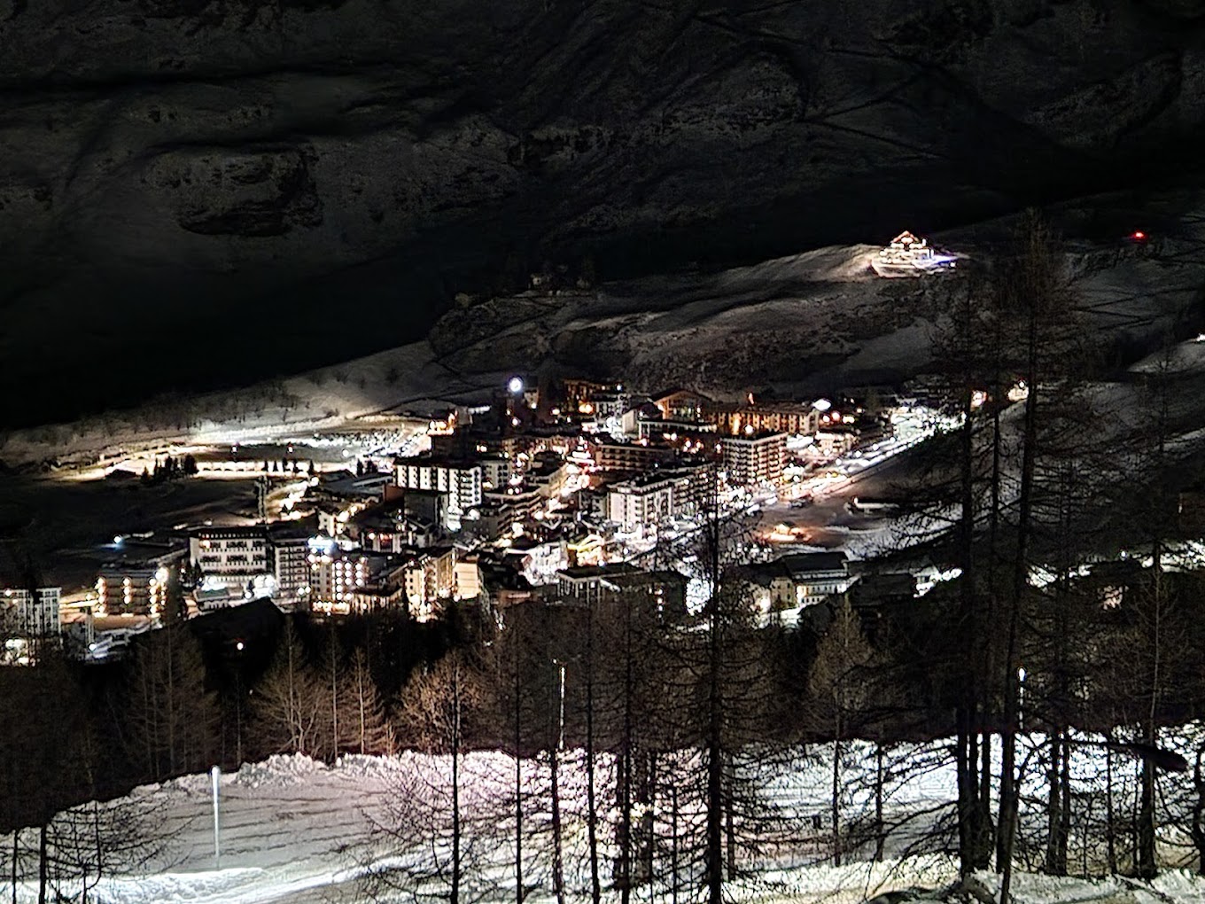Cervinia Cielo Alto in Italy - a city lit up at night in the mountains.