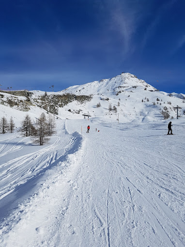 Wolli Park Sunnegga in Switzerland - a person skiing down a snow covered mountain.
