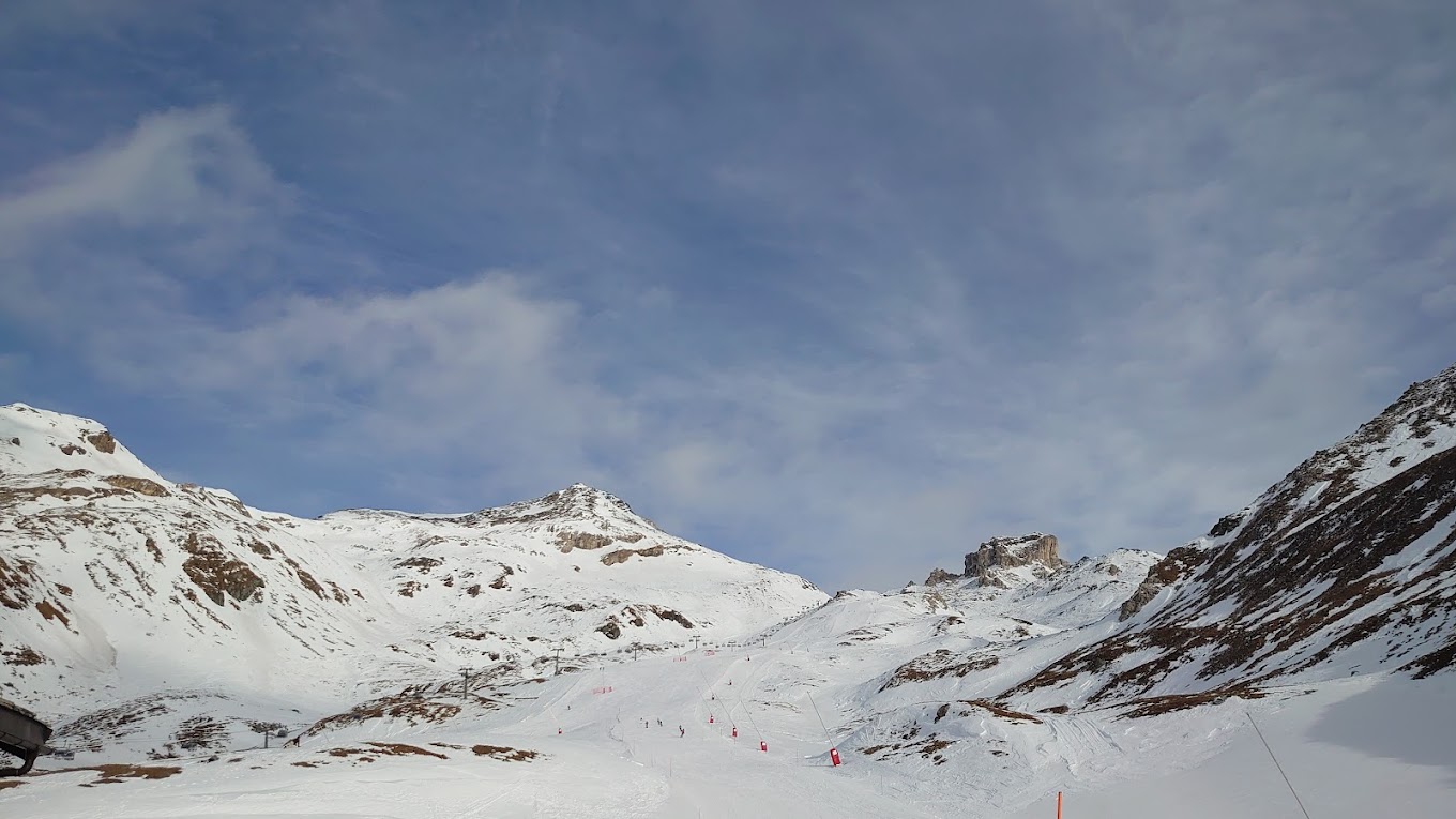 Cime Bianche Funivie Valtournenche in Italy - a person on a snowboard in the snow.