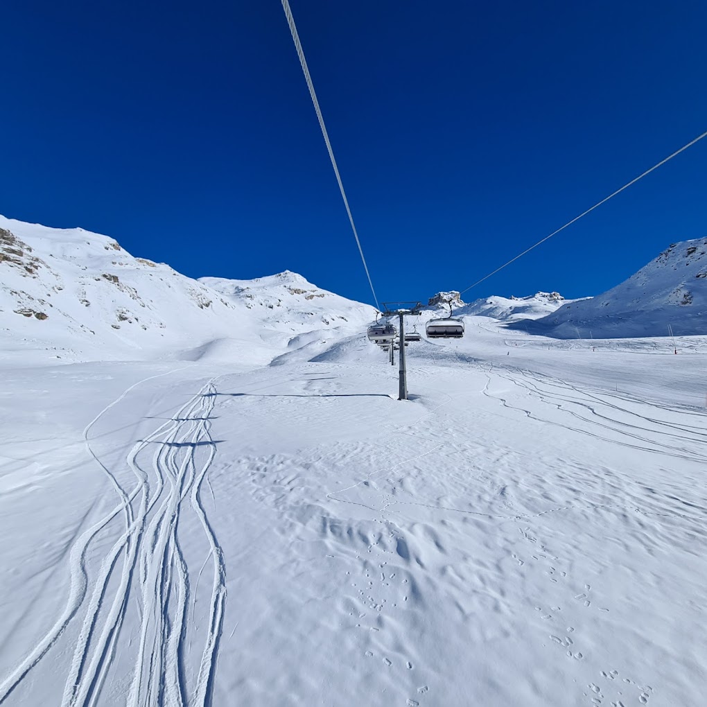Cime Bianche Funivie Valtournenche in Italy - a ski lift going up a snowy slope.