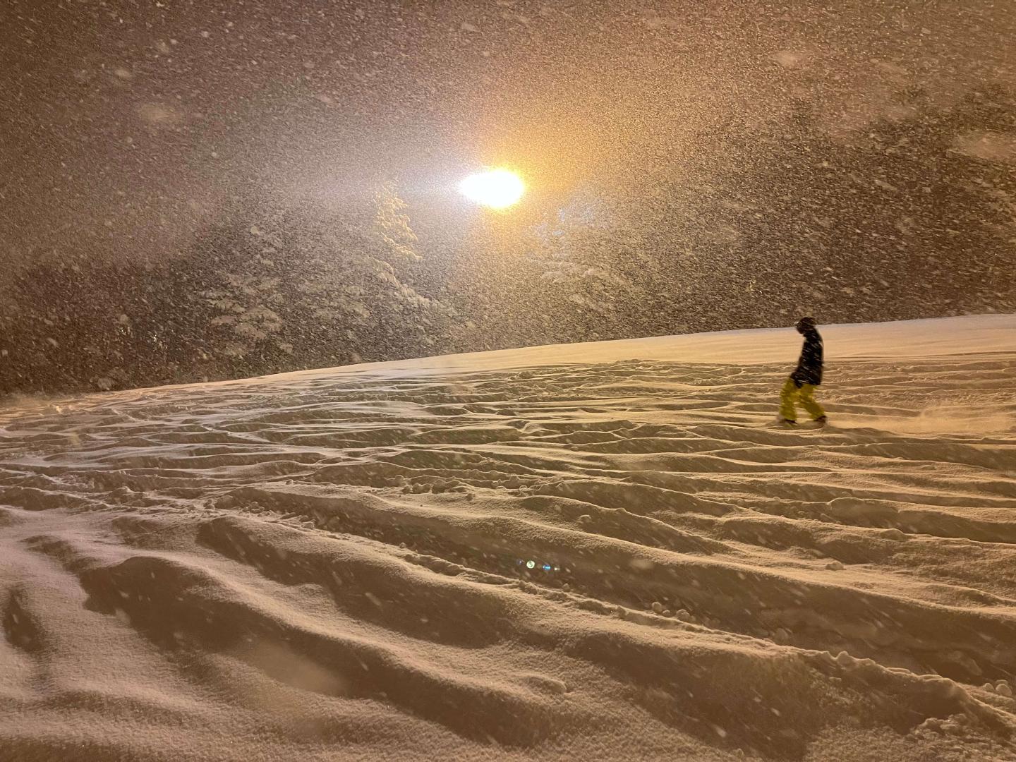 Washigatake Ski in Japan - a person on a snowboard in the snow.