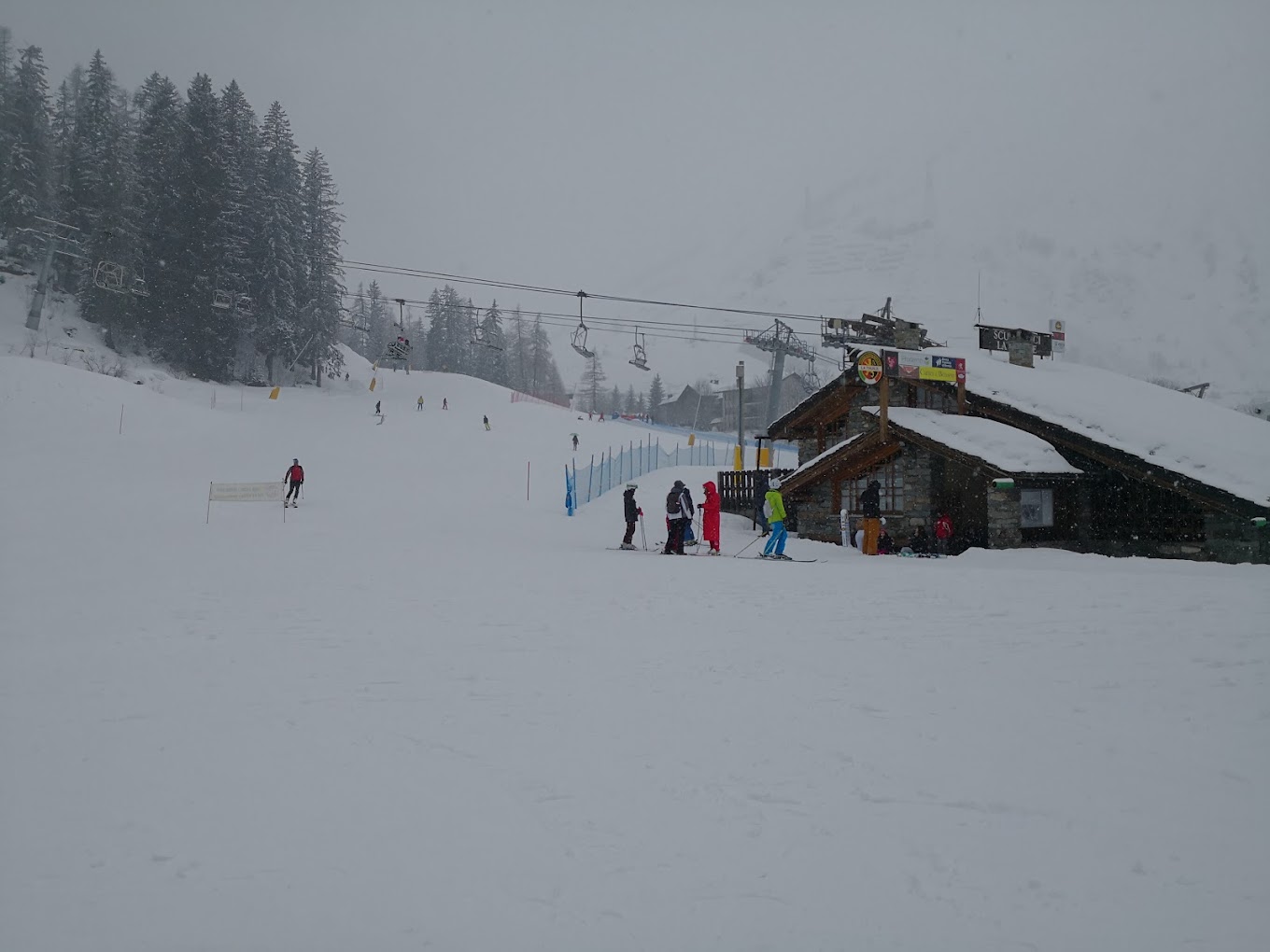 Centro sci di fondo in Italy - a group of people skiing down a snowy slope.